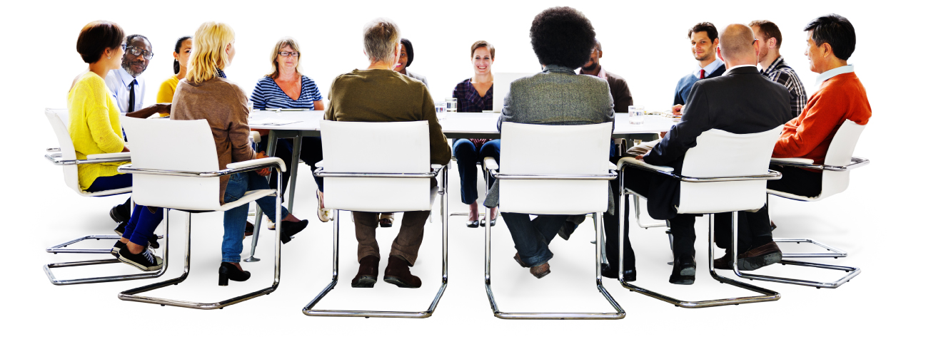 Diverse group of people / members sitting in white chairs around a table having a discussion.